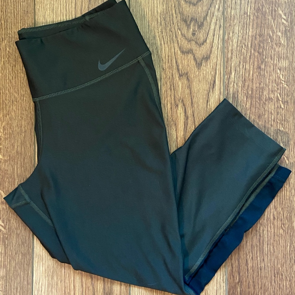 Nike leggings. Capri length. Army green with black detail on the sides. Size M.